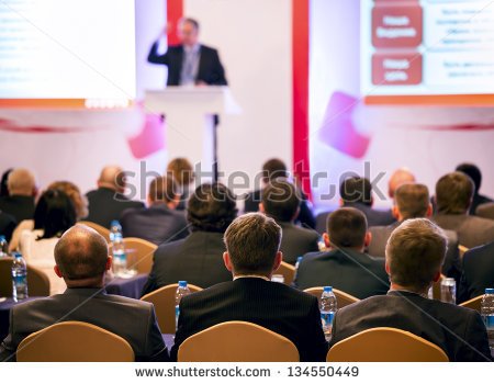 stock-photo-people-at-the-conference-hall-rear-view-134550449
